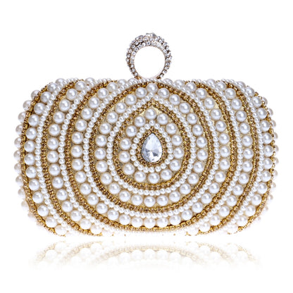 Pearl evening handbag with gold-tone trim, teardrop crystal, and circular top handle