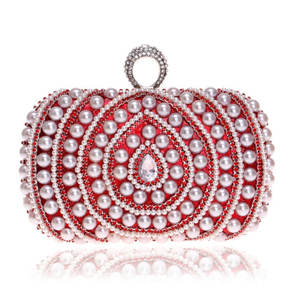 Red pearl clutch with rhinestone bands and a crystal centerpiece
