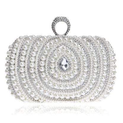 White pearl clutch with silver-tone rhinestone trim and crystal accent