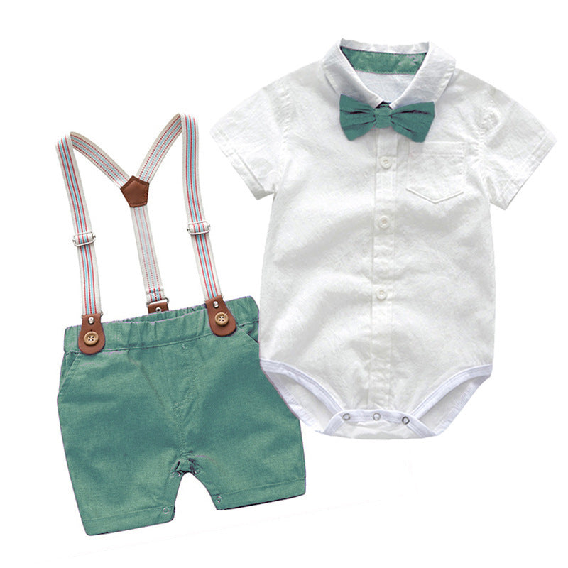 The Baby Boy Gentleman Suit - 2 Piece Summer Set features a white short-sleeve button-up onesie with a green bow tie and pocket, paired with green shorts and adjustable striped suspenders with brown leather accents. Perfect for summer!.