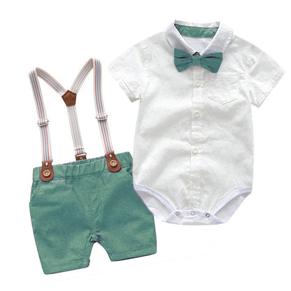 The Baby Boy Gentleman Suit - 2 Piece Summer Set features a white short-sleeve button-up onesie with a green bow tie and pocket, paired with green shorts and adjustable striped suspenders with brown leather accents. Perfect for summer!.