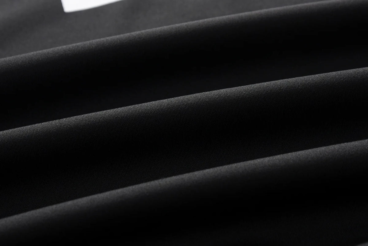 Black fabric close-up with smooth matte texture