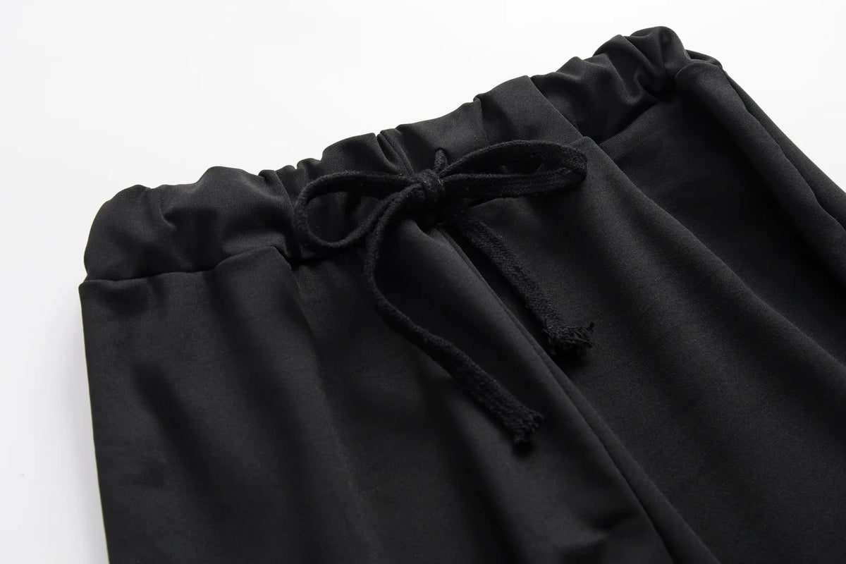 Black drawstring hoodie neckline and relaxed sweatshirt front