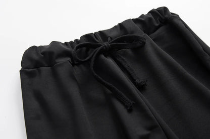 Black drawstring hoodie neckline and relaxed sweatshirt front