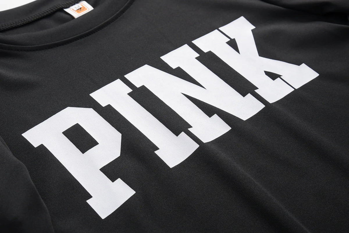 Black sweatshirt fabric close-up with large white “PINK” letter print