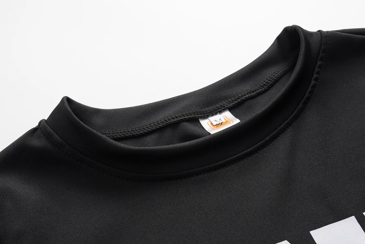 Black sweatshirt neckline close-up with ribbed collar and small brand label