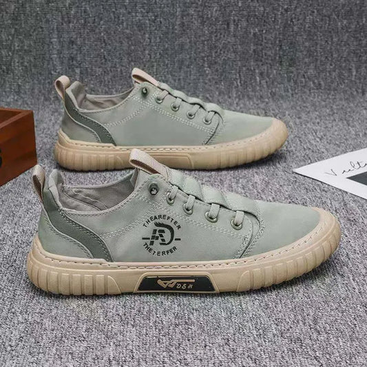 Men's sage green lace-up shoes with beige soles and side logo, shown in profile