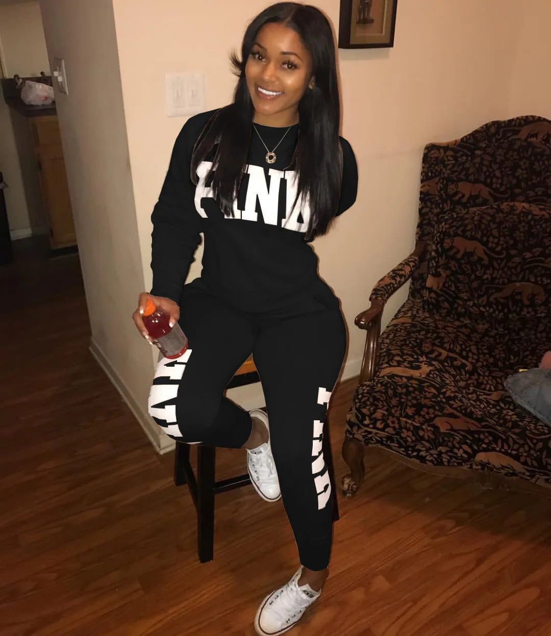 Women's letter-print set in black: white NLA logo on long-sleeve top and jogger pants