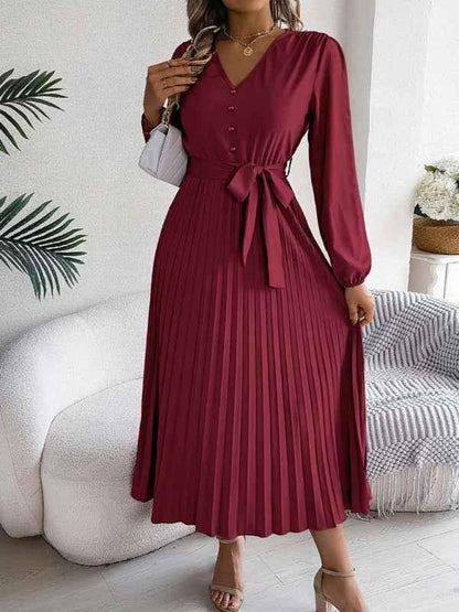 Elegant V-neck Pleated Dress with Button Tie Hem – Timeless Style - Shello's Creative Boutique