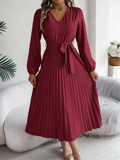 Elegant V-neck Pleated Dress with Button Tie Hem – Timeless Style - Shello's Creative Boutique